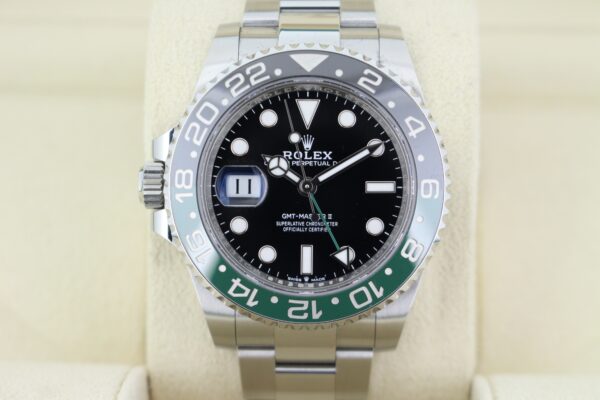 Zoomed in photo of the rolex sprite on an oyster bracelet