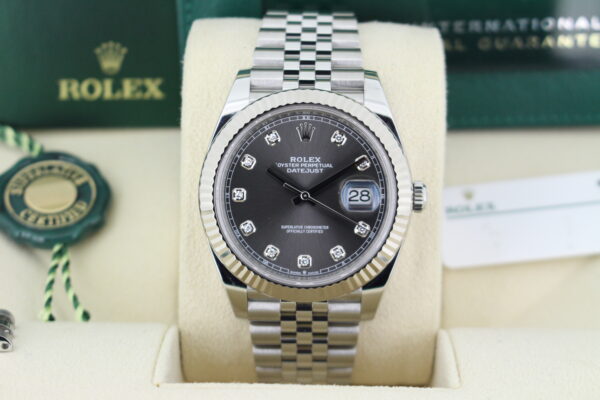 Rolex Datejust Diamond Slate Dial 126334 close up the watch in it's box with both green and white swing tags, booklets and warranty card