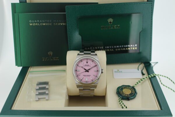 Rolex Oyster Perpetual 36 126000 with pink dial in it's box with both green and white swing tags and spare links, booklets and warranty cards
