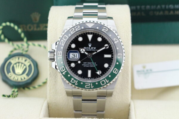 Rolex GMT Master II Sprite 126720VTNR close up of in it's box with both swing tags, booklets and warranty card