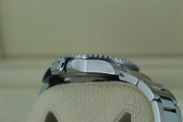Rolex GMT Master II Sprite 126720VTNR side view of the crown, showing no imperfections or marks