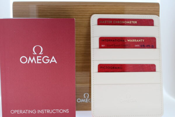 Omega box, warranty card and manuals