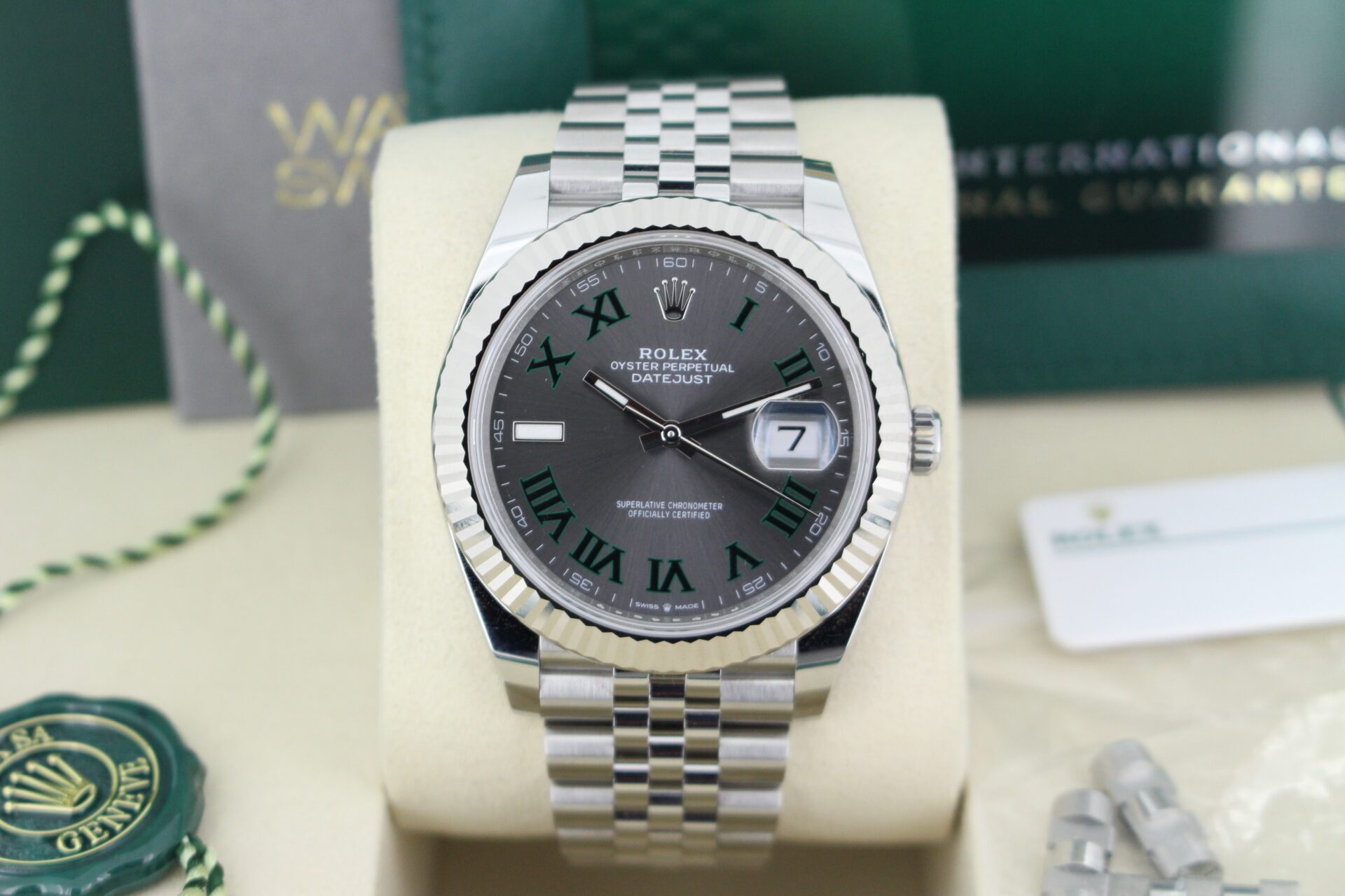 Close up of Rolex Datejust 41 Wimbledon 126334 in it's box with swing tags, link, booklets, warranty card and original purchase receipt