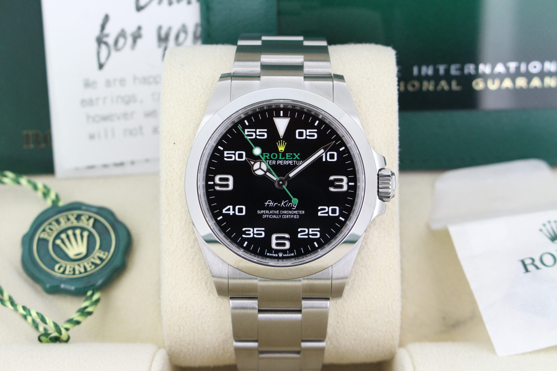 Close up of a Rolex Air-King 126900 in it's box with booklets, swing tag, warranty card and original purchase receipt