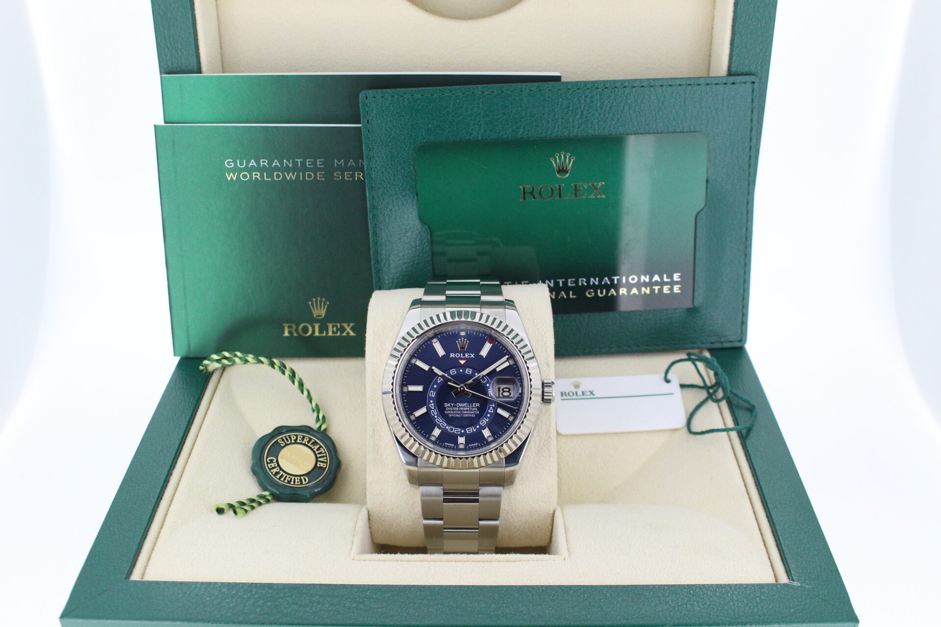 A blue rolex sky dweller in its box with all original accessories making a full set