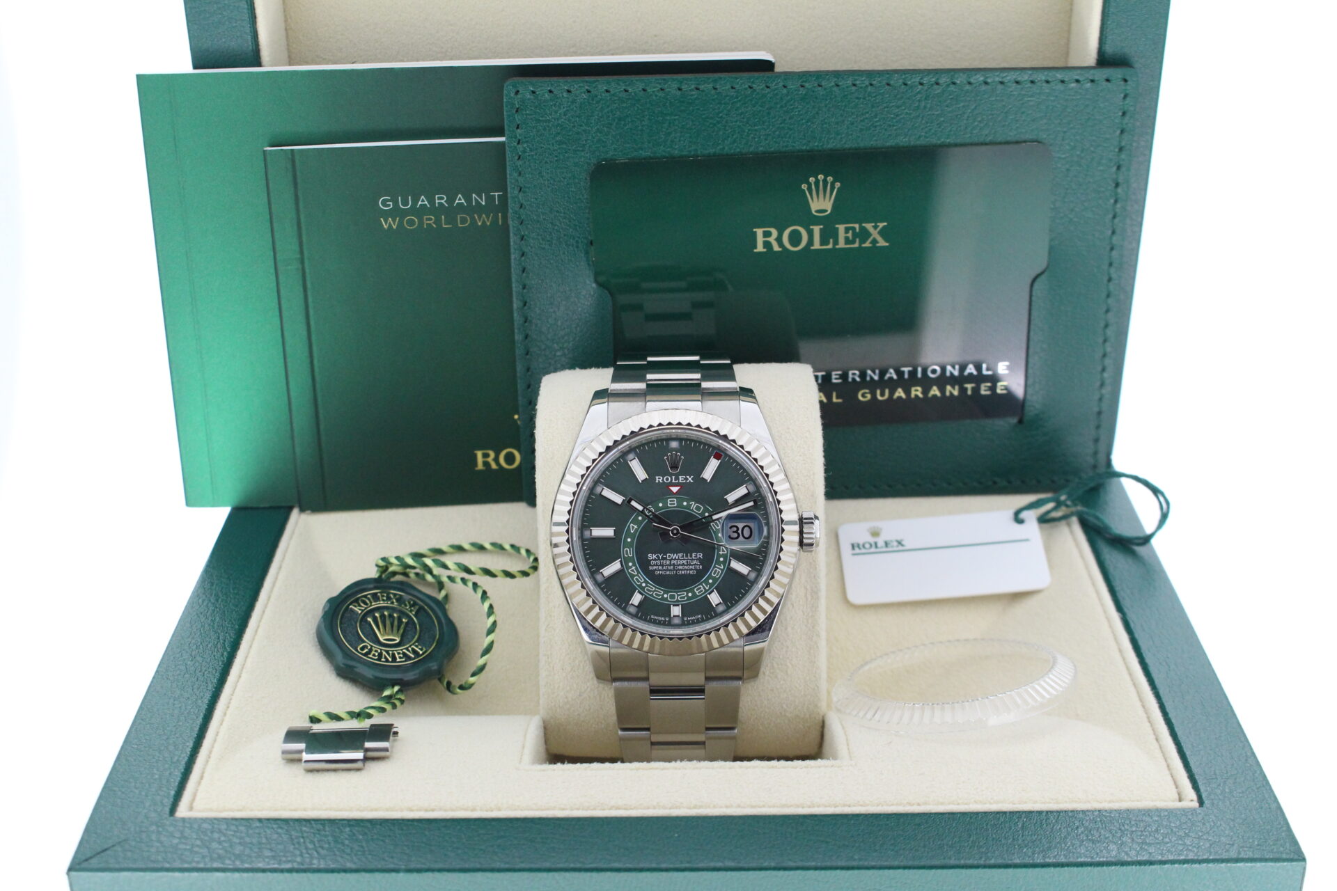 Rolex Sky-dweller 336934 Green Dial in it's box with booklets, warranty cards and both swing tags