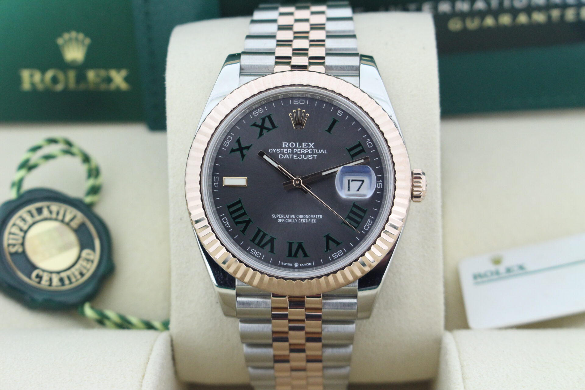 Close up of Rolex Datejust Wimbledon Bi-Metal Jubilee 126331 in it's box with booklets, both swing tags and warranty cards