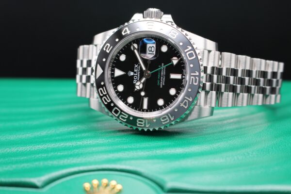 Rolex 126710GRNR on a jubilee bracelet on top of a green wabe box