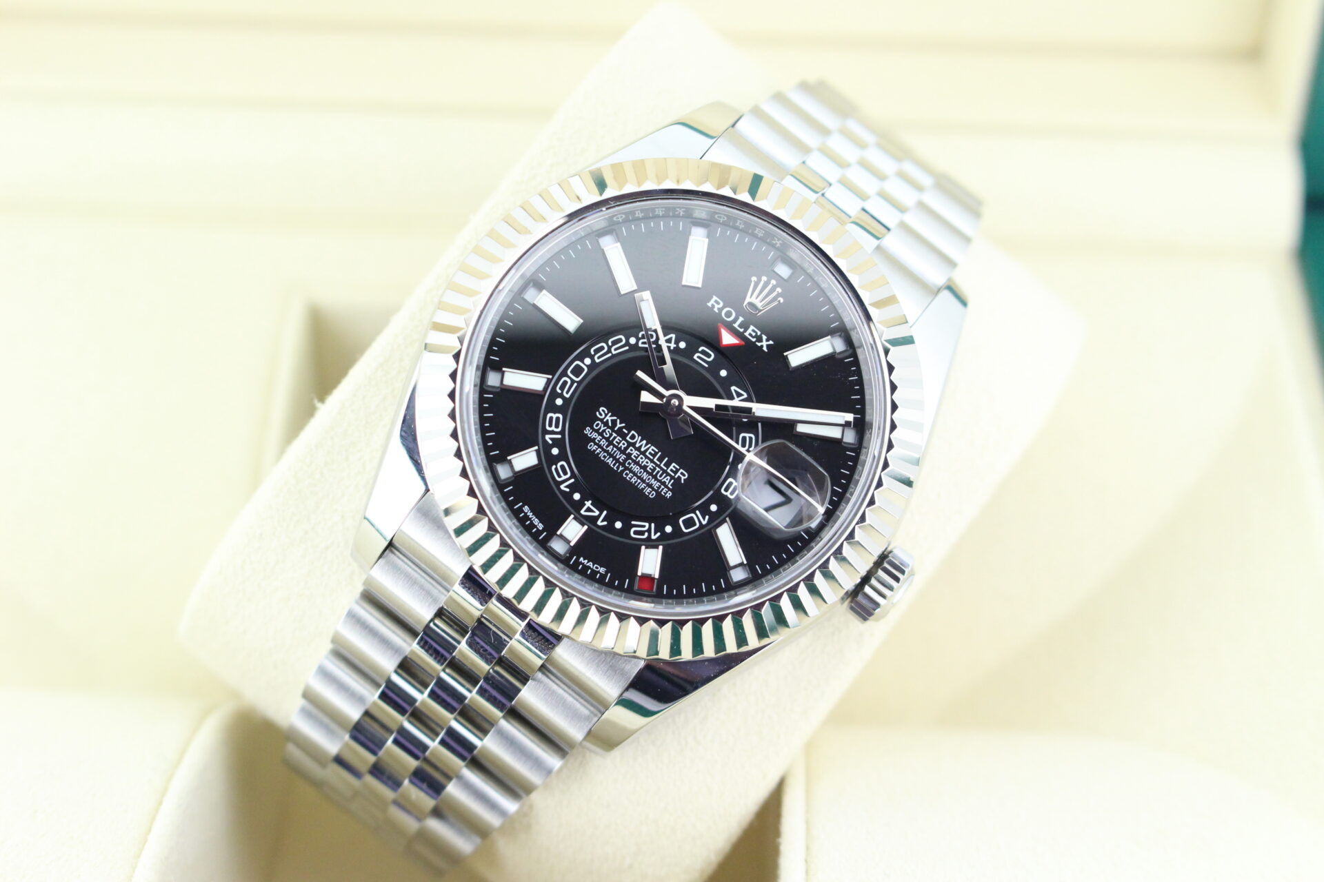 Black Dial fluted bezel sky dweller titled back with light reflecting of the dial