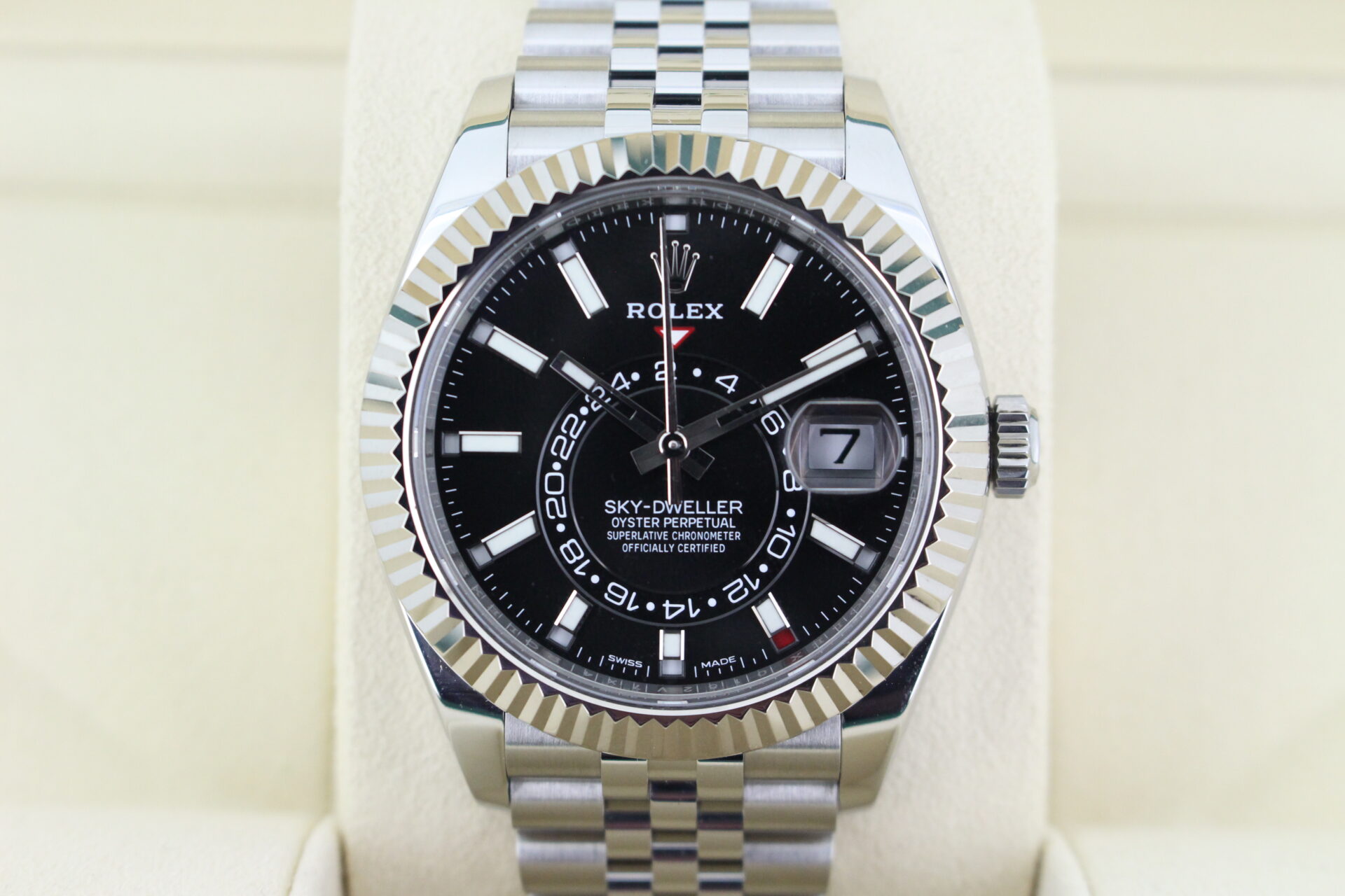 Close up picture of Rolex Sky-Dweller with a black dial world timer watch