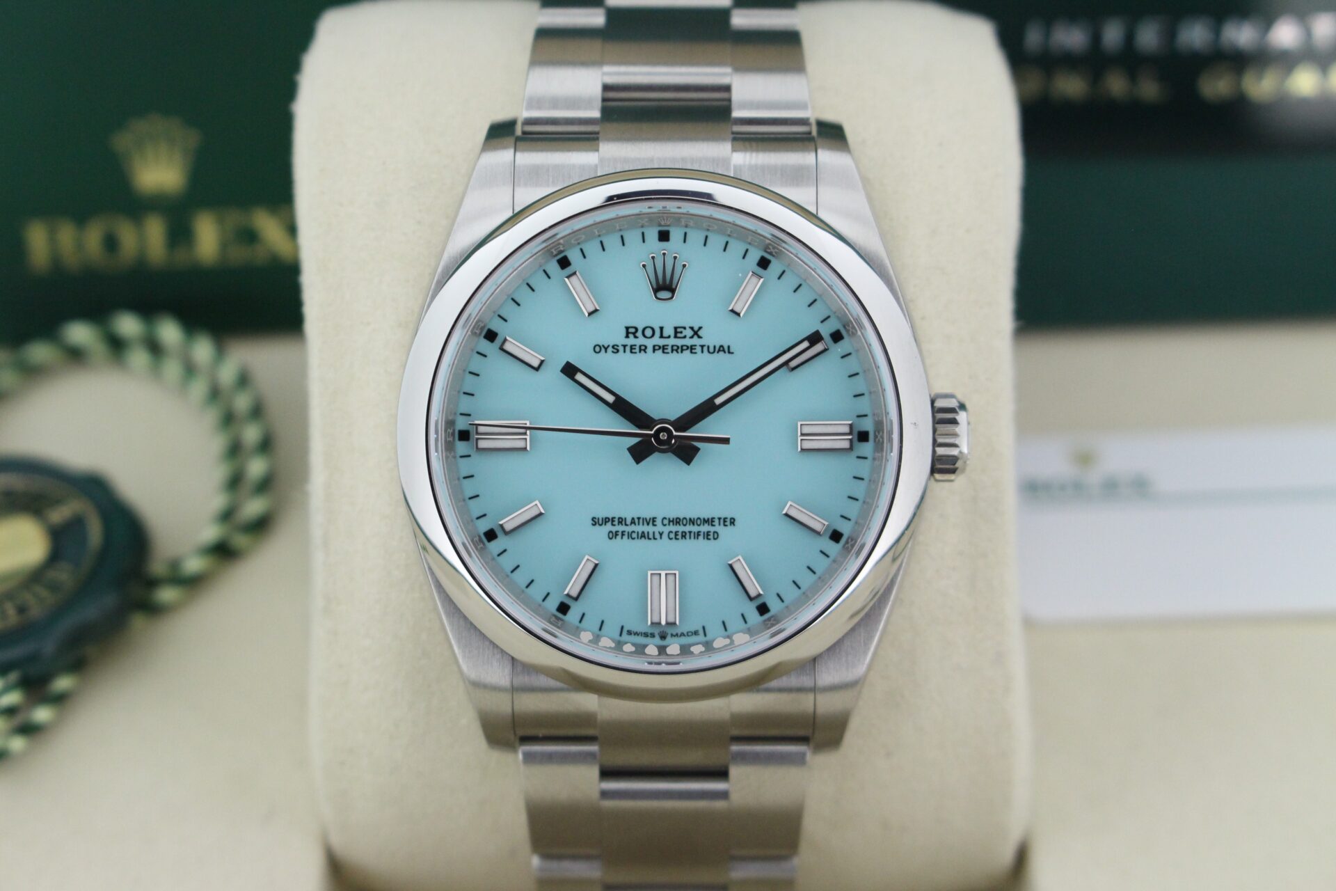 Close up of Rolex Oyster Perpetual 36 Tiffany 126000 in it's box with both swing tags, booklet and warranty card