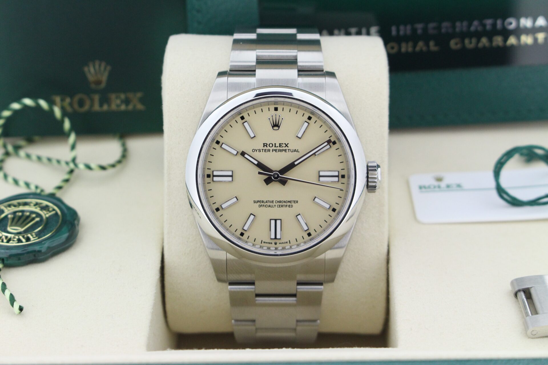 Close up of Rolex Oyster Perpetual 41mm Beige 134300 in it's box with both swing tags, booklets and warranty card