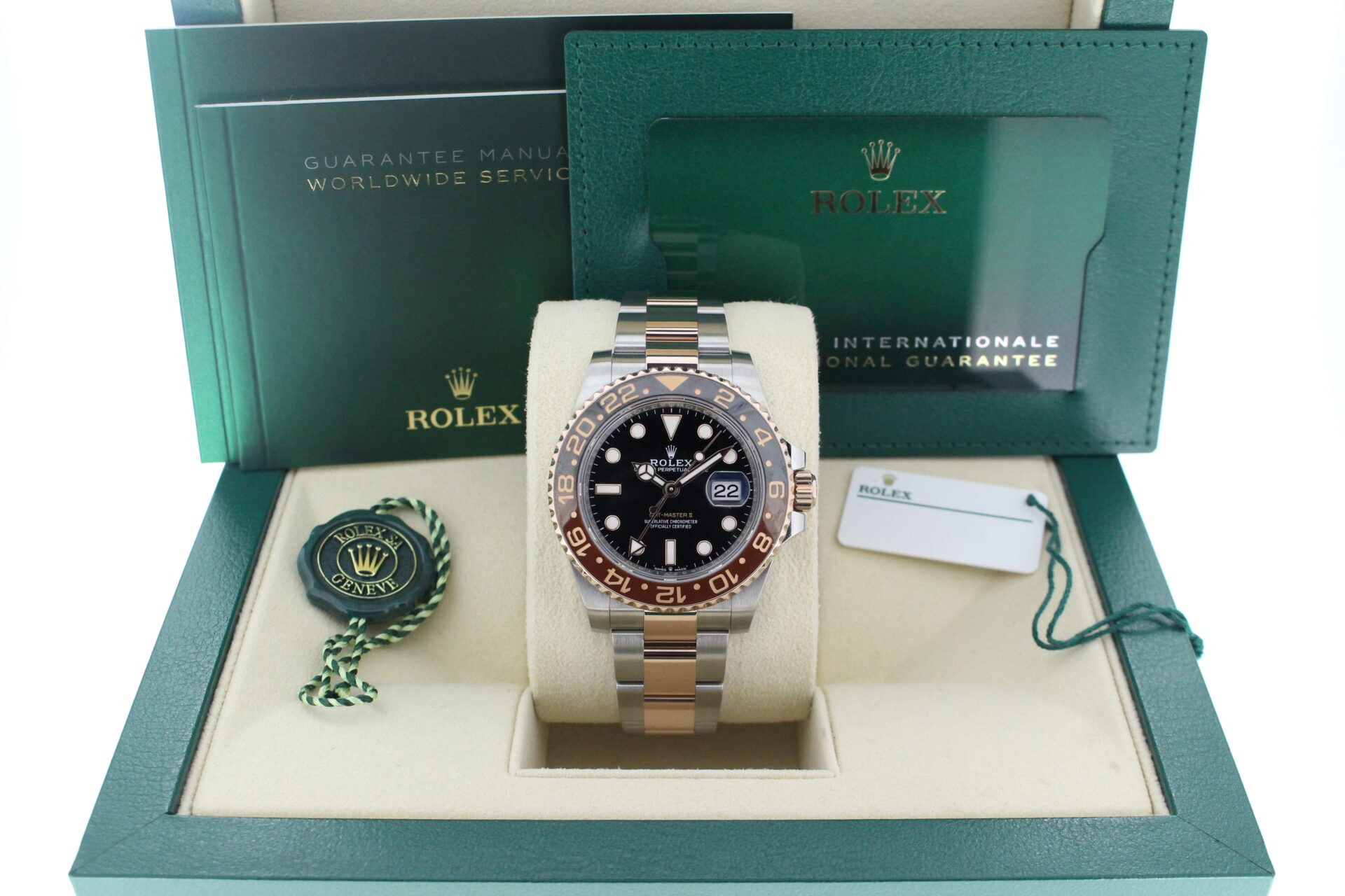 Rolex GMT Master II Rootbeer 126711CHNR in it's bow with both swing tags, booklets and warranty card