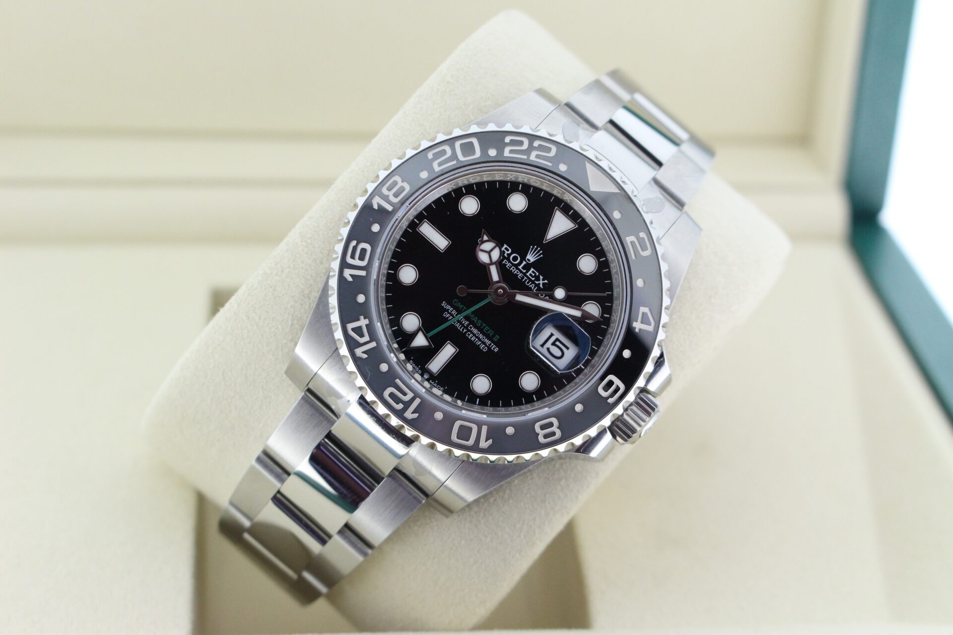 Rolex GMT Master II Bruce Wayne 126710GRNR tilted in it's box