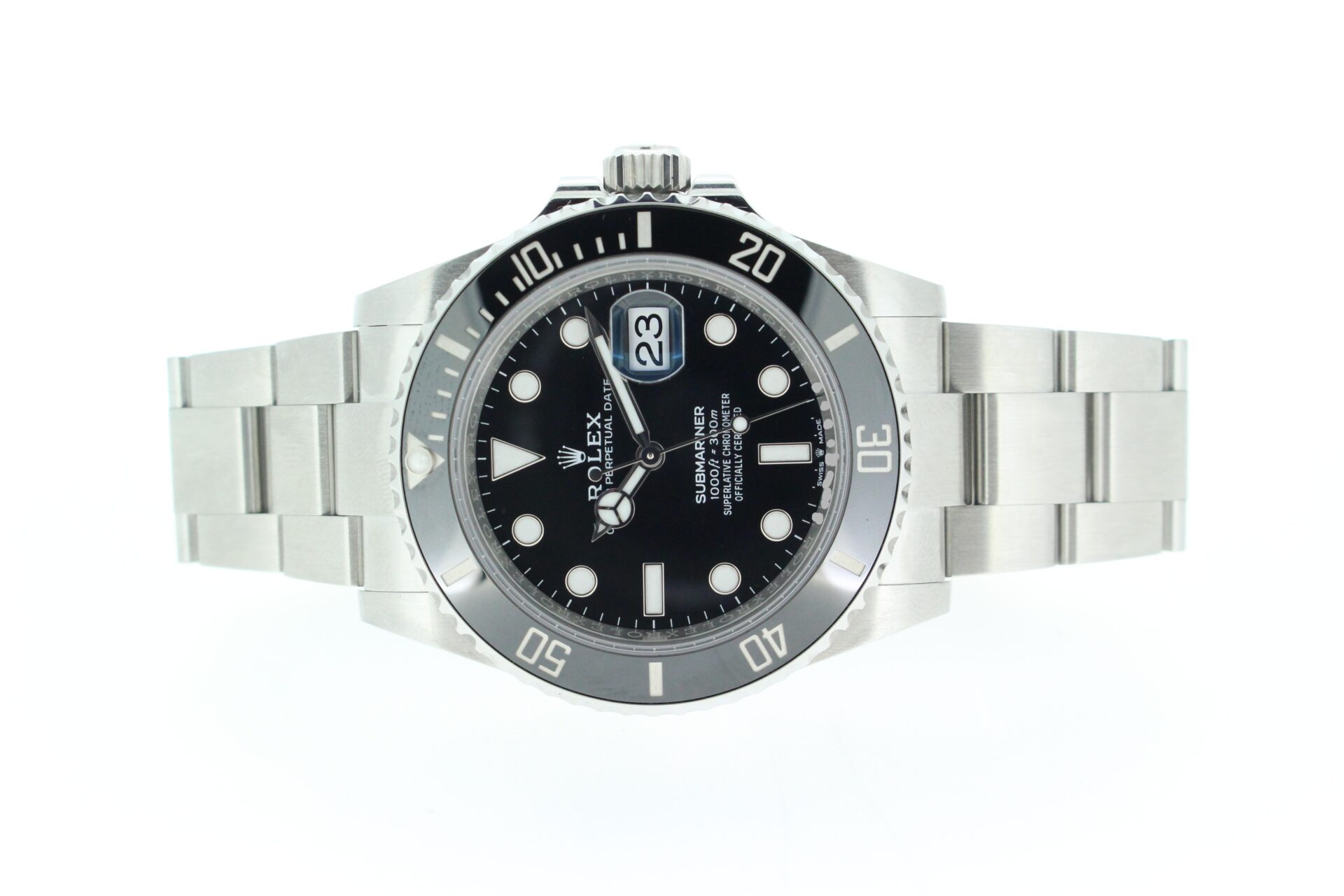 Rolex sub date on a white background watch laid down