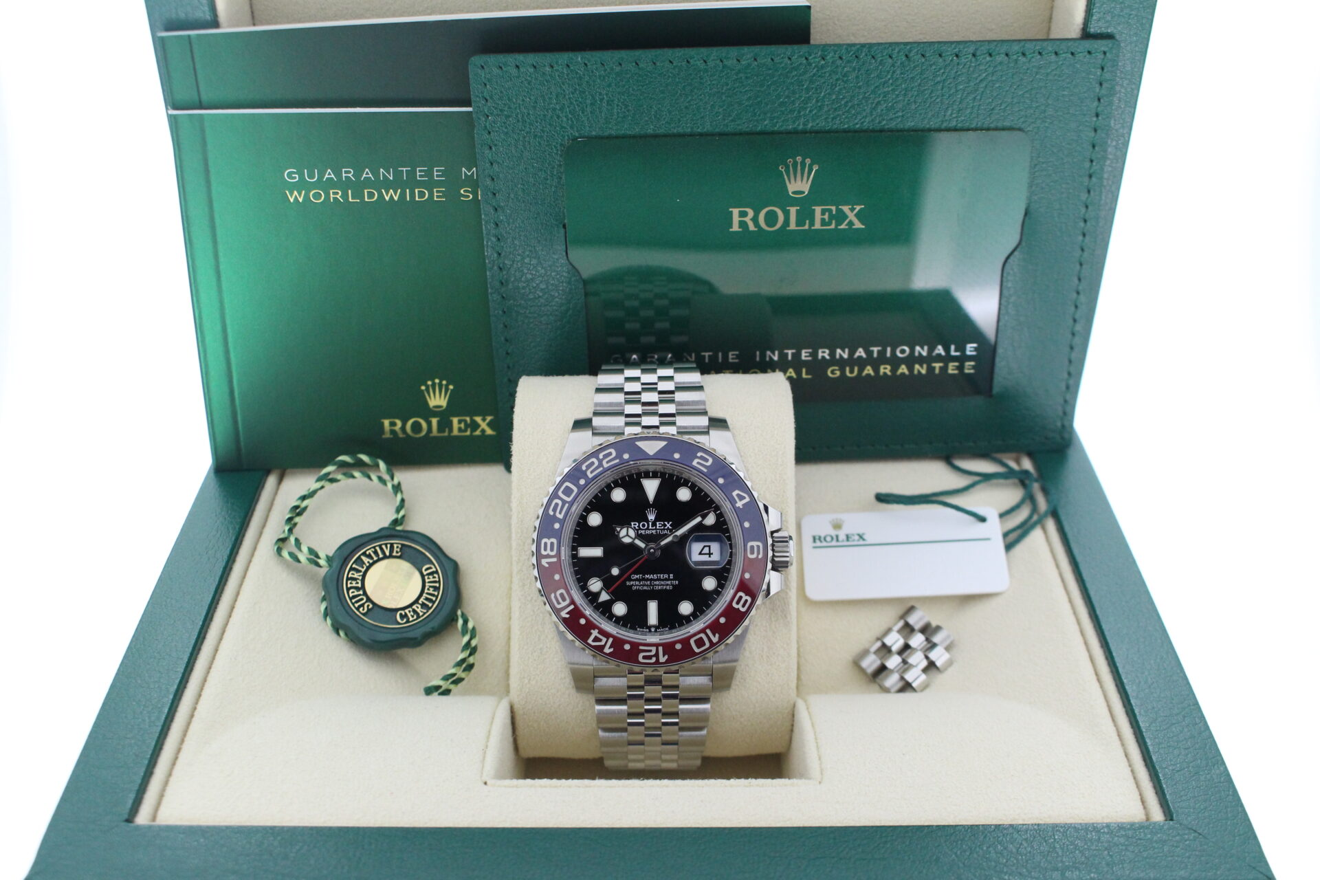 Rolex GMT Master II Pepsi 1261710BLRO in it's box with both swing tags, booklets and warranty card
