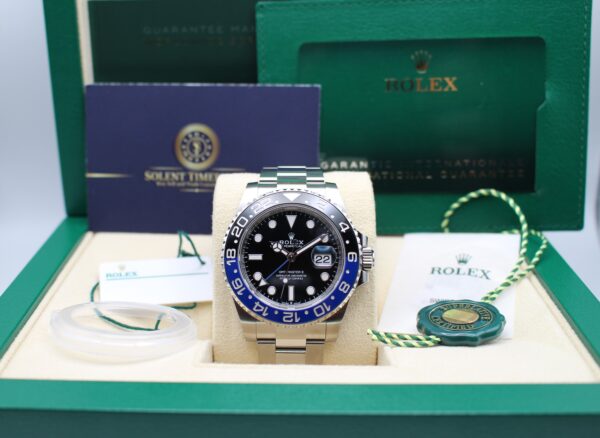 A Rolex GMT Master II 126710BLNR Batman in its box with swing tags, warranty card and manuals