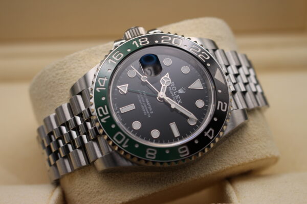 Rolex GMT Master II Sprite laid down in a low light setting