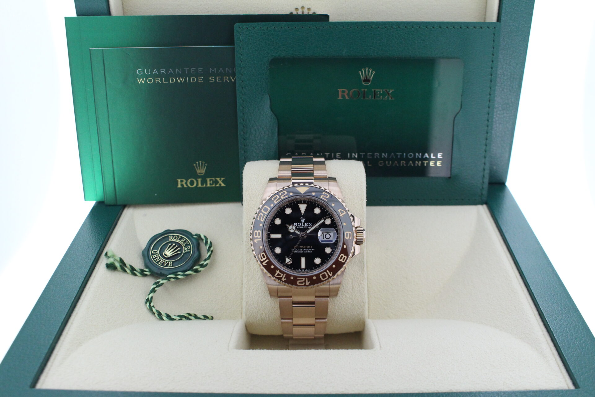 Rolex GMT Master II Full Everose Rootbeer 126715CHNR in it's box with green swing tag, booklet and warranty card