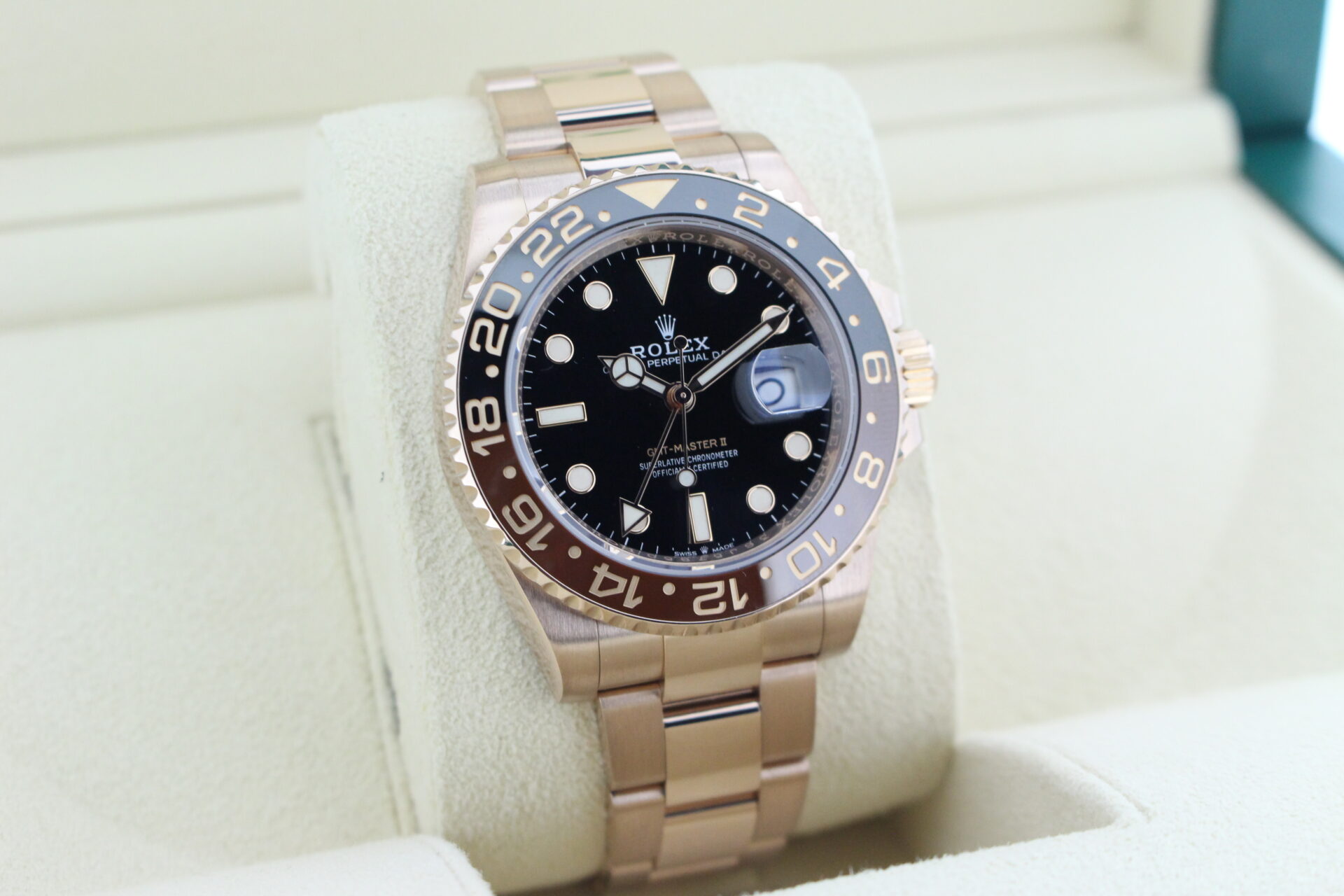 Rolex GMT Master II Full Everose Rootbeer 126715CHNR facing towards the right to show the left angle