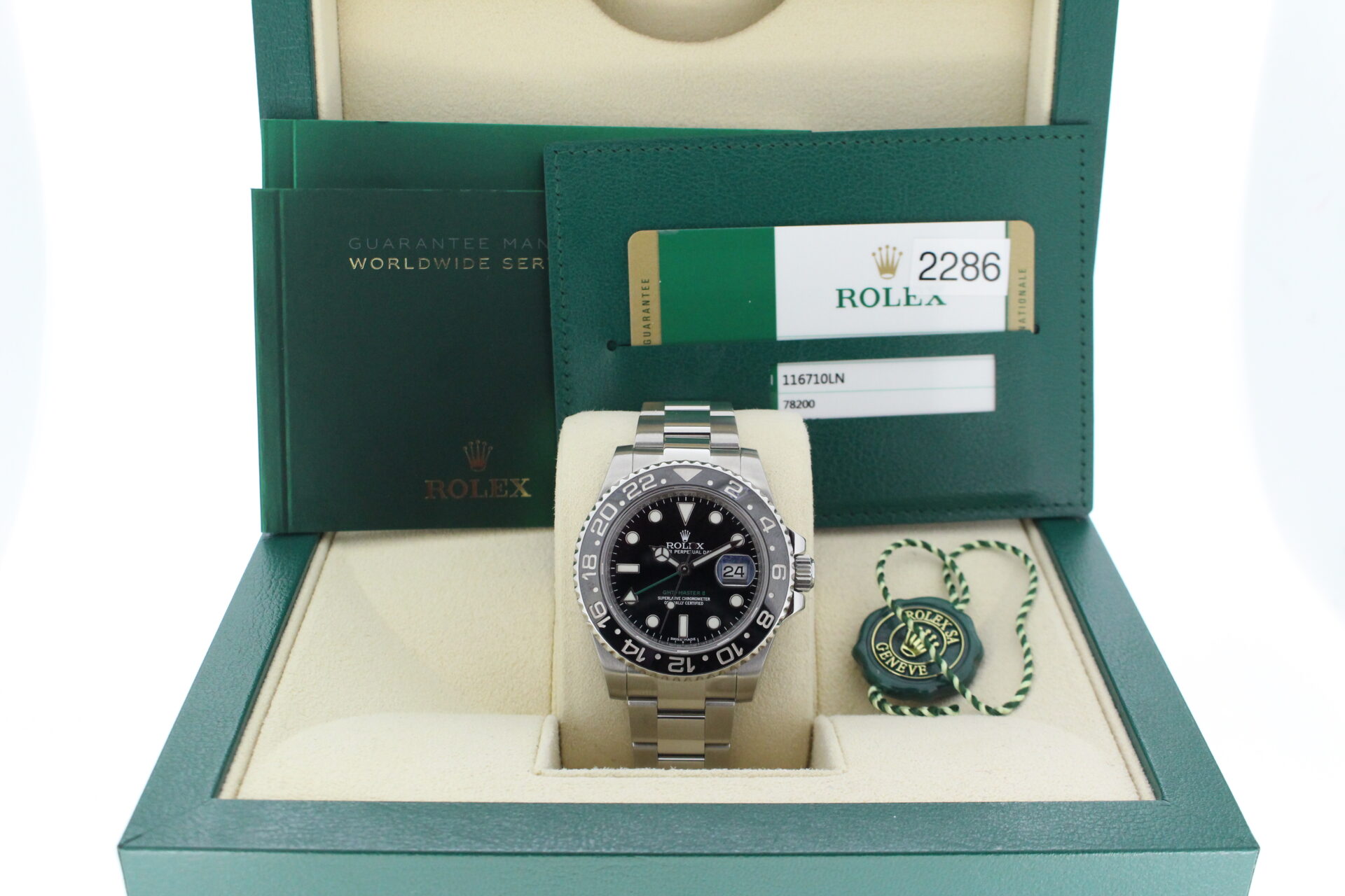 Rolex GMT Master II Black 116710LN in it's box with green swing tags, booklets and warranty card dated October 2015