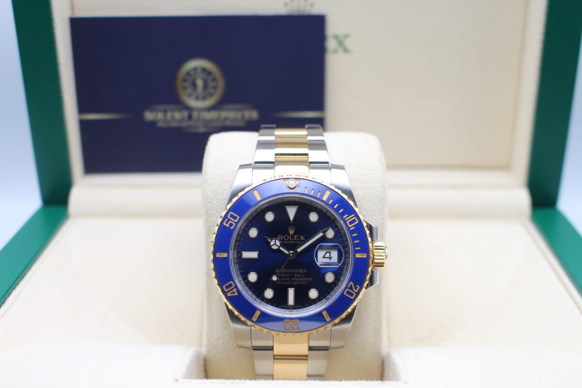 Rolex Submariner 116613LB in a Rolex box with Solent Timepieces Logo behind