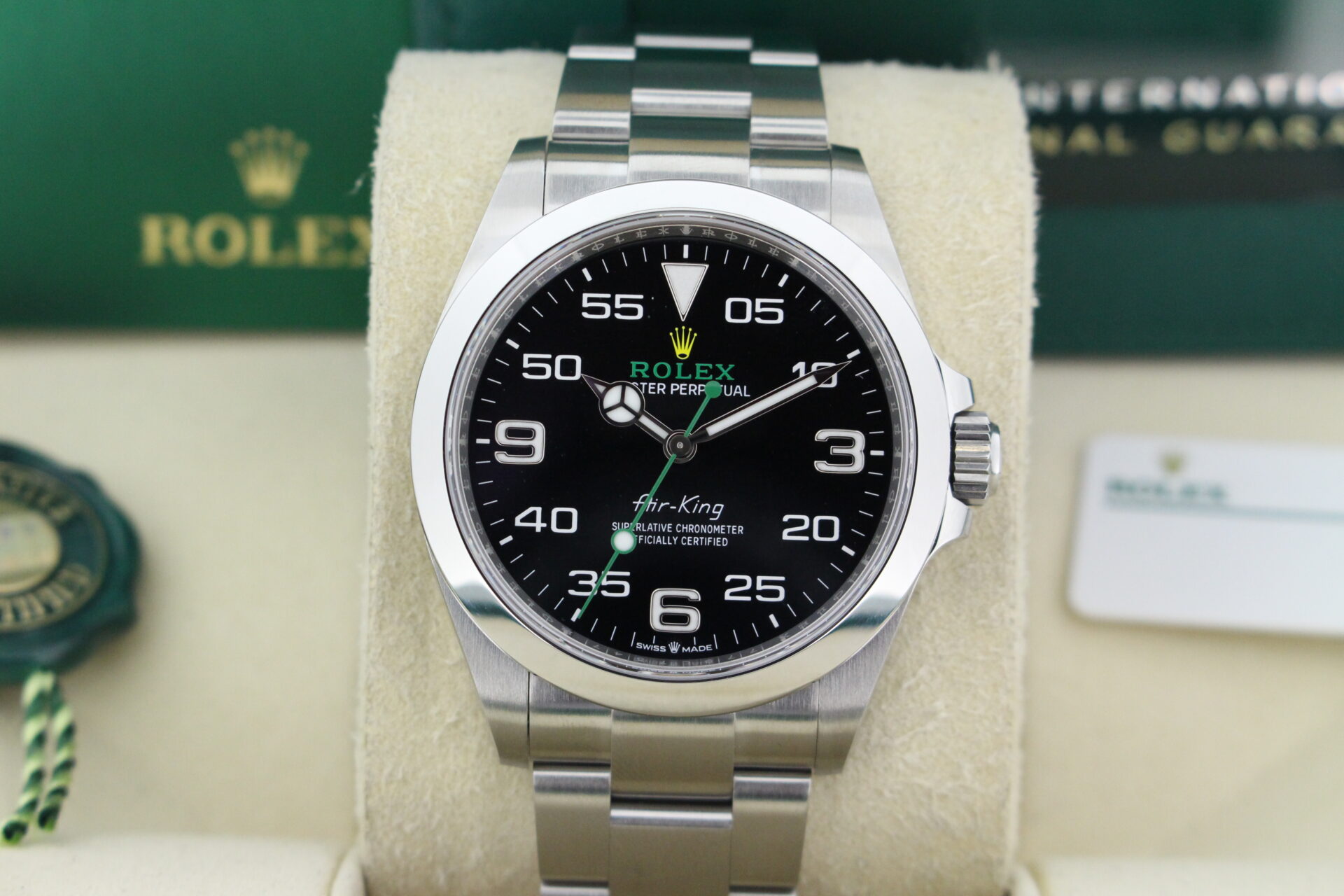 Close up of Rolex Air King 126900 in it's box with both swing tags, booklets and warranty card