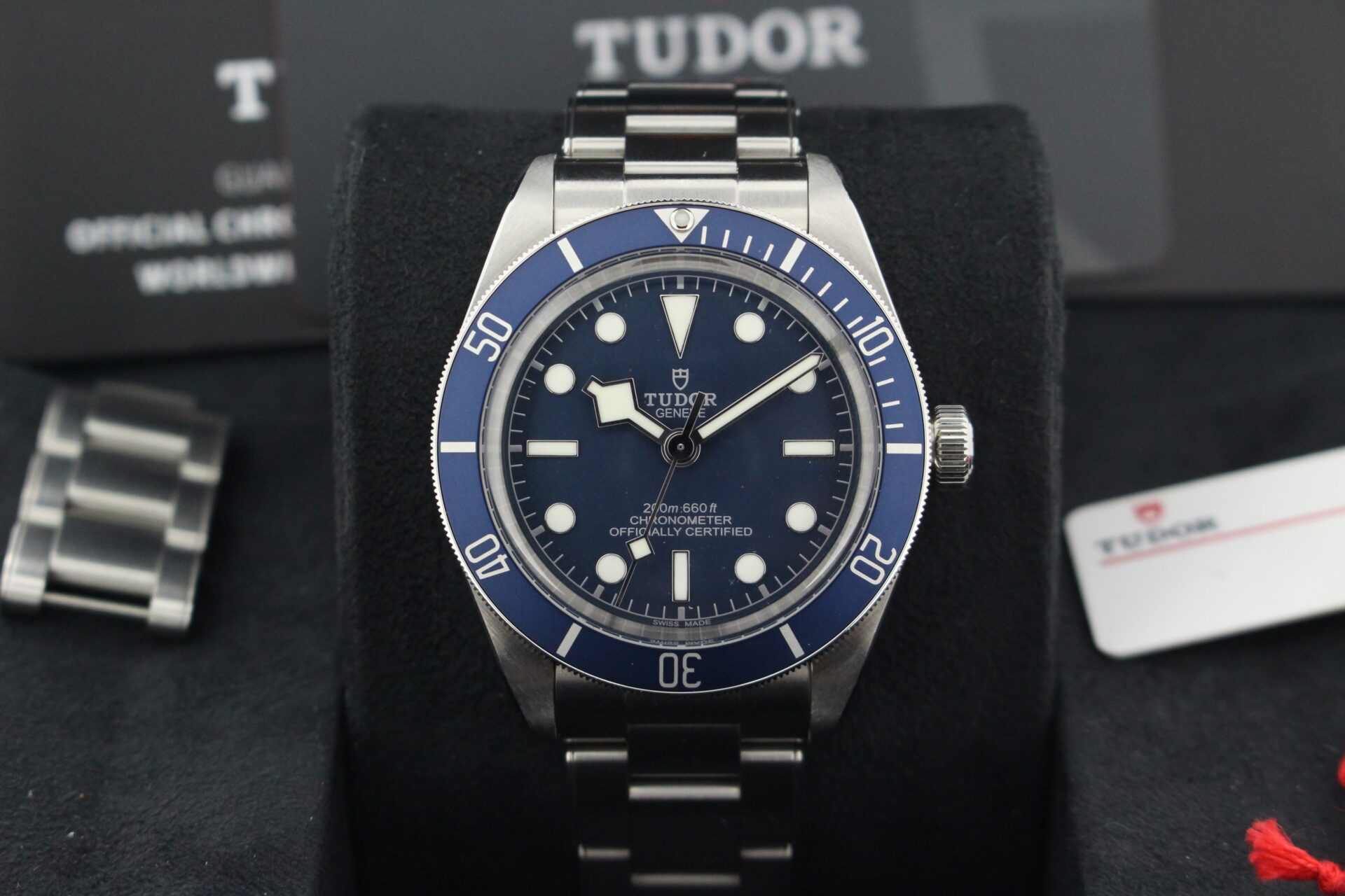 Close up of Tudor Black Bay 58 79030B in it's box with swing tag, booklets and warranty card