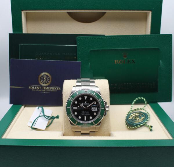 A Rolex Starbucks on display in its box with all accessories on show