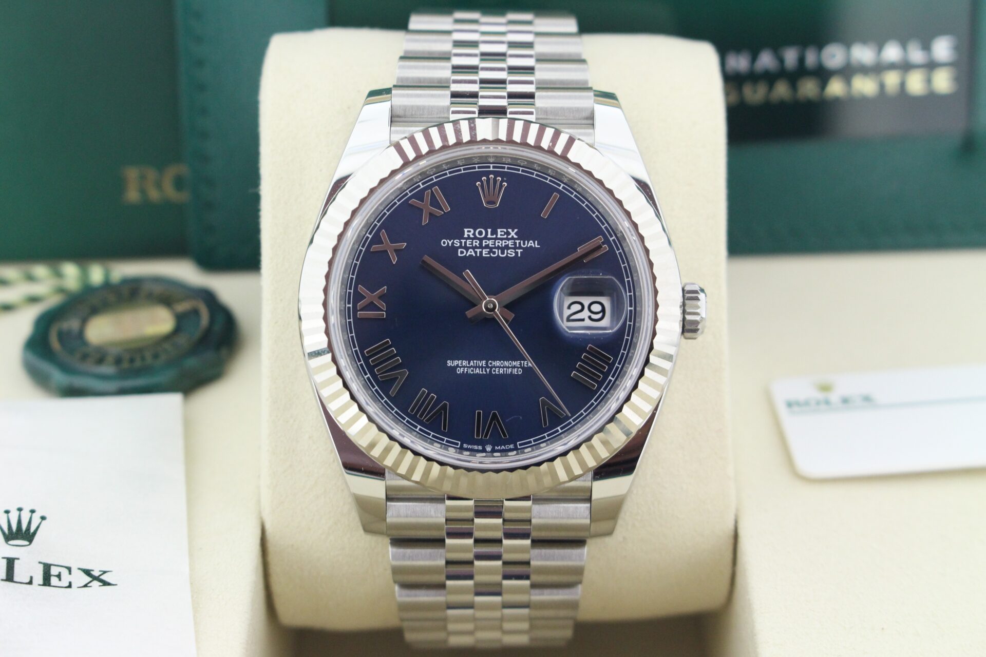 Close up of Rolex Datejust 41 Azzurro 'New Release' 126334 in it's box with both swing tags, link, booklet and warranty card