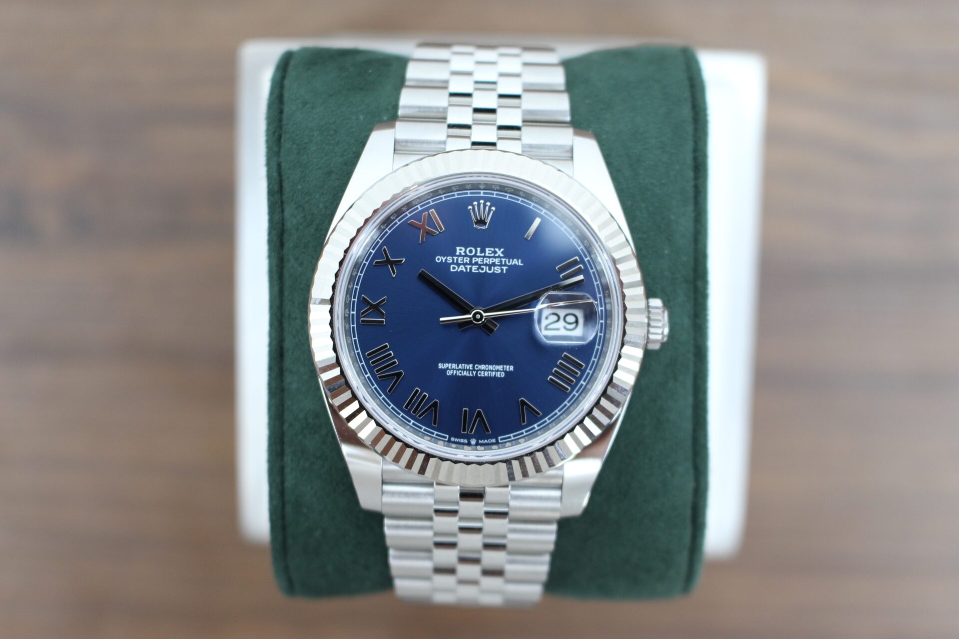 Rolex Datejust 41 Azzurro 'New Release' 126334 on a green cushion