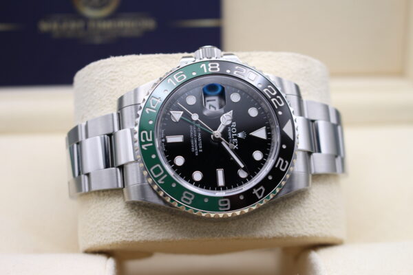 Rolex GMT Master II Sprite on its cushion on its side