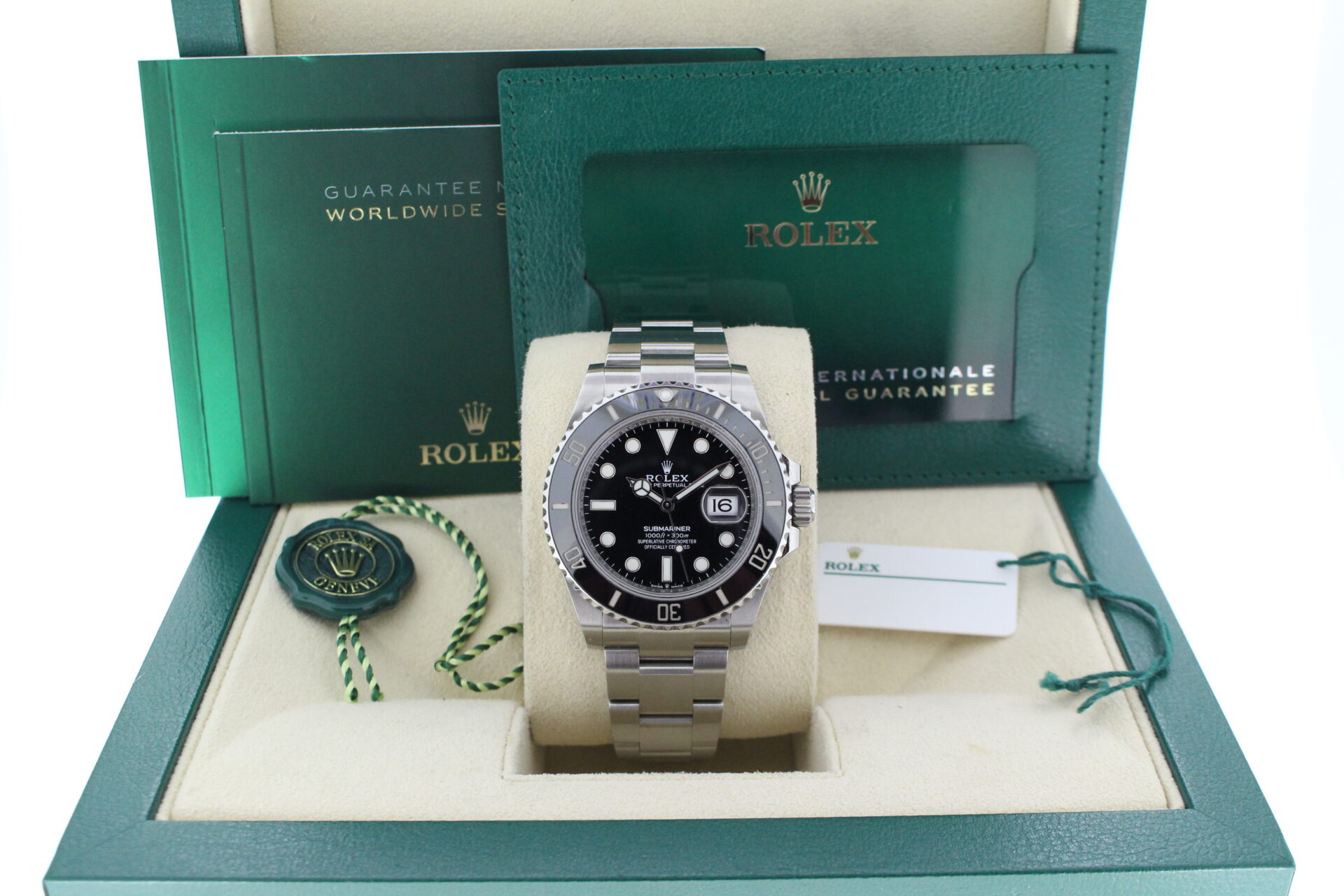 Rolex submariner 41 in its original box with papers and accessories making a full set