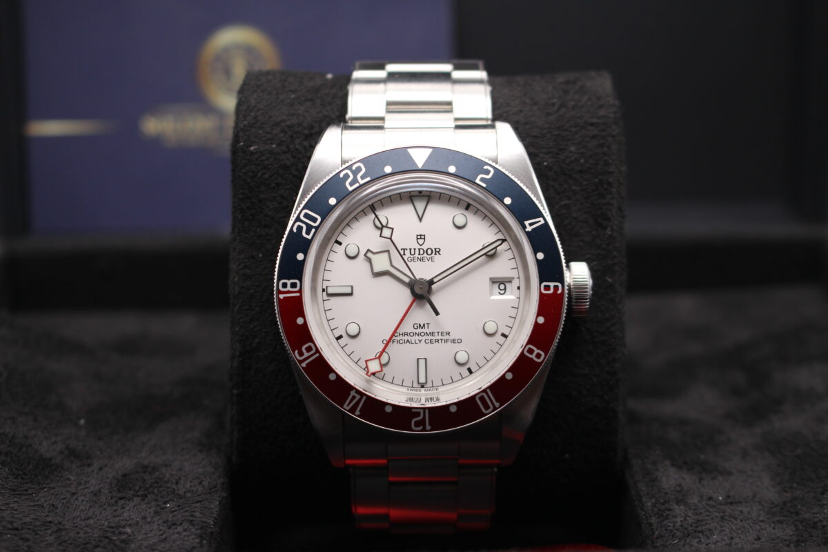 Tudor GMT with Opaline dial upright on its cushion reading 10 past 10