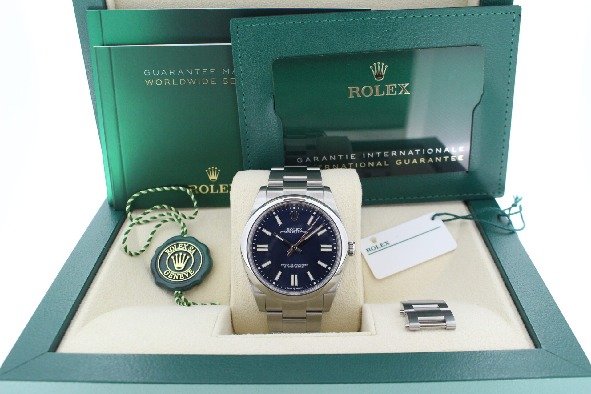 Rolex Oyster Perpetual 41 124300 in it's box with both swing tags, booklets and warranty card