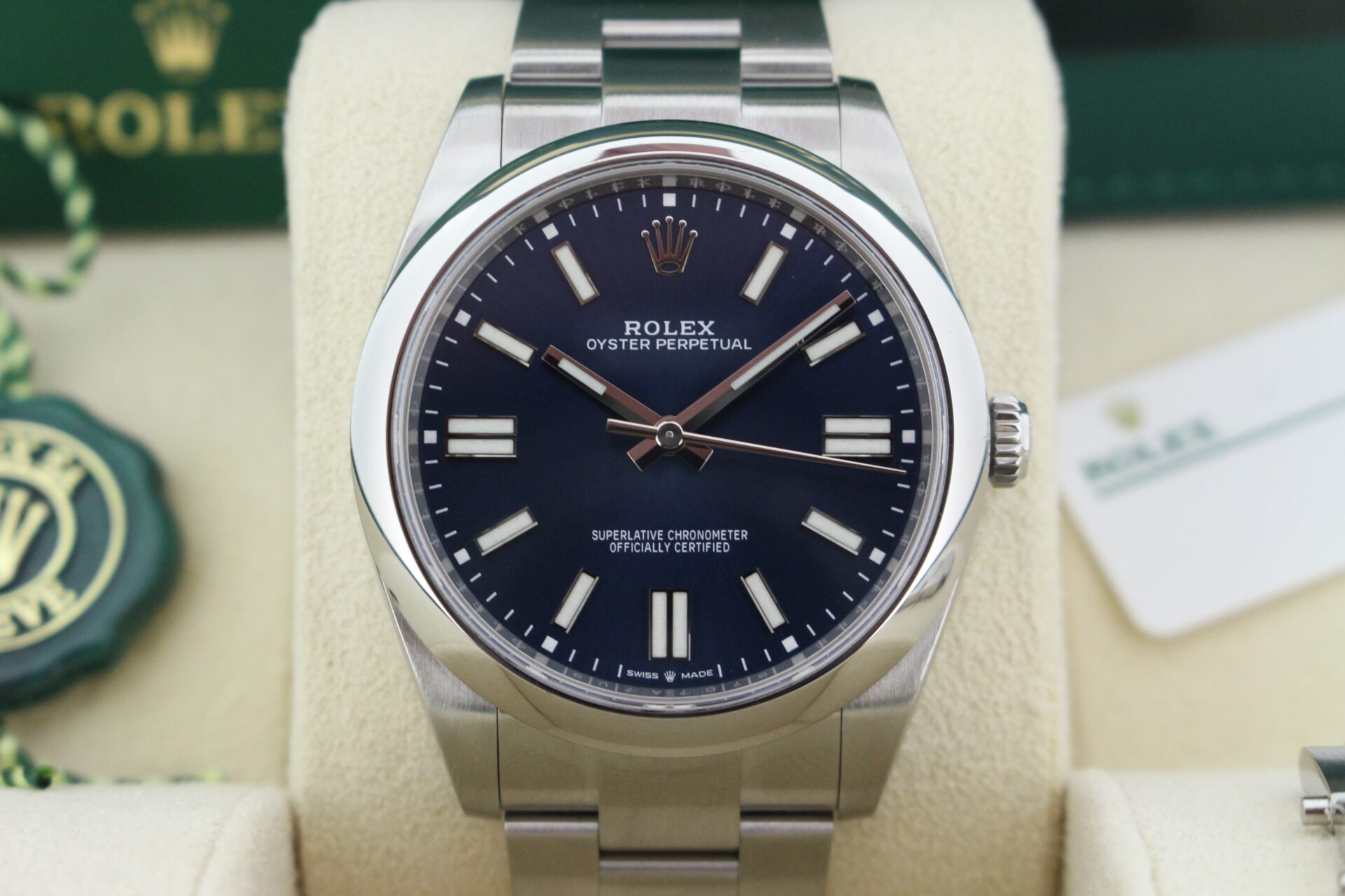 Close up of Rolex Oyster Perpetual 41 124300 in it's box with both swing tags, booklets and warranty card