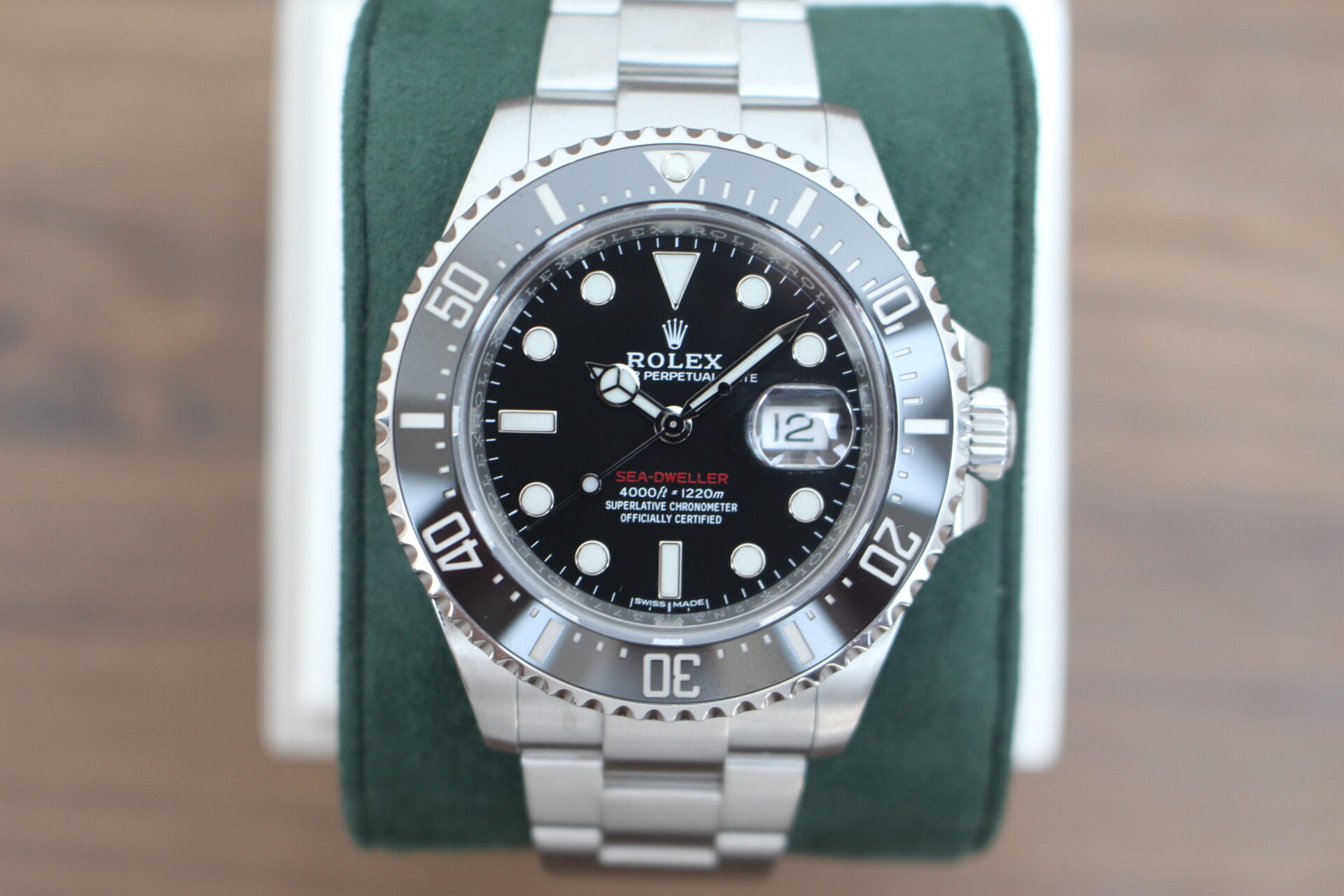 Rolex Sea-Dweller 50 Anniversary 126600 on a green cushion
