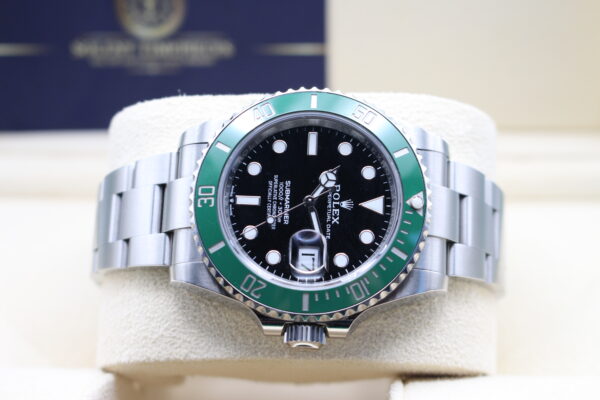 Rolex 126610LV turned on its side with a Solent Timepieces Logo in the back