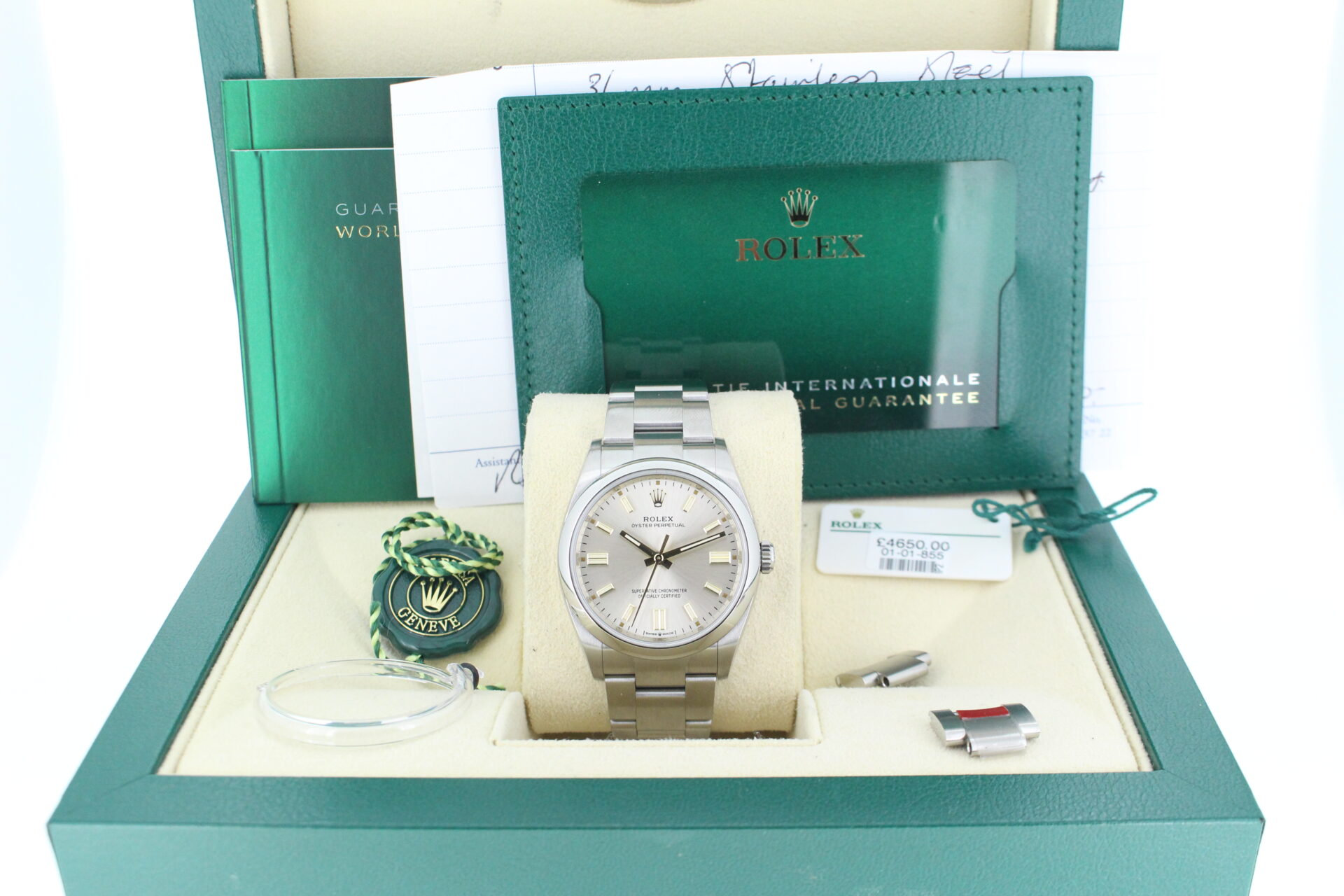 Rolex Oyster Perpetual 36 Silver 126000 with both swing tags, booklets, original purchase receipt and warranty card