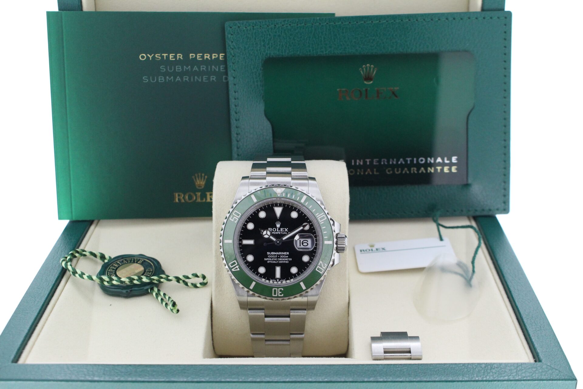 Rolex Green bezel submariner in its box with all original accessories making a full set