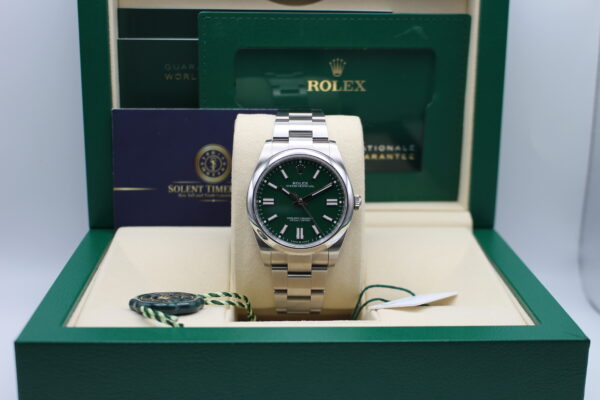 Rolex OP41 124300 with a green dial in its box with all original accessories