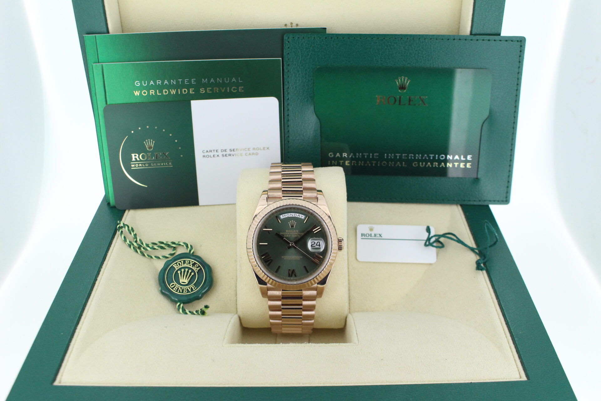 Rolex Day-Date 40 Rose Gold Olive 228235 in it's box with both swing tags, booklets and warranty card