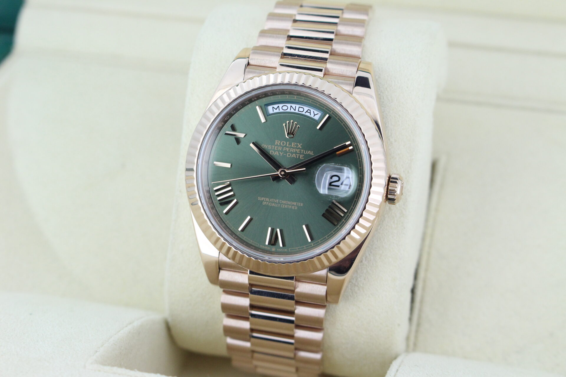 Rolex Day-Date 40 Rose Gold Olive 228235 facing towards the left to show the right angle