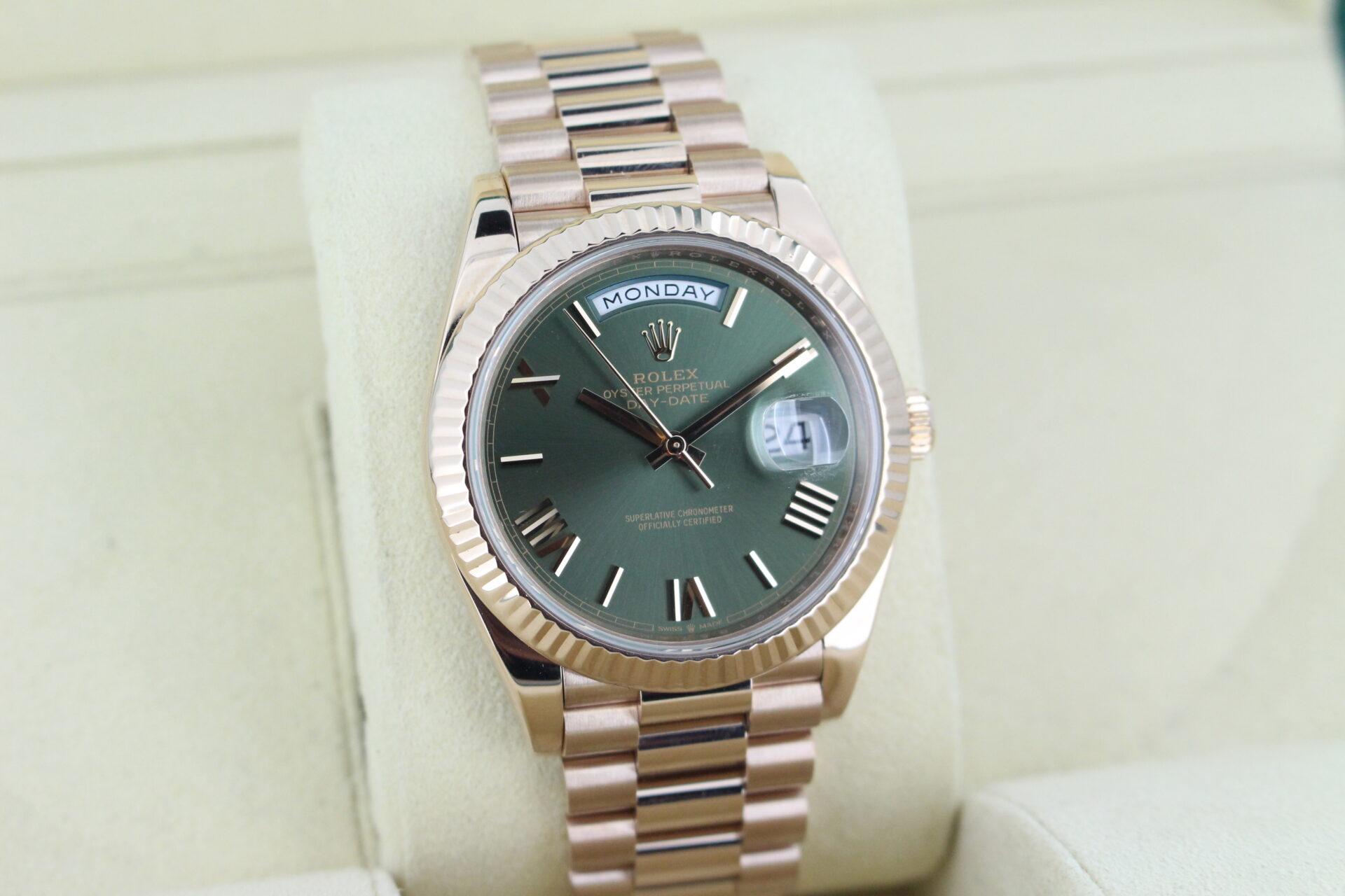 Rolex Day-Date 40 Rose Gold Olive 228235 facing towards the right to show the left angle