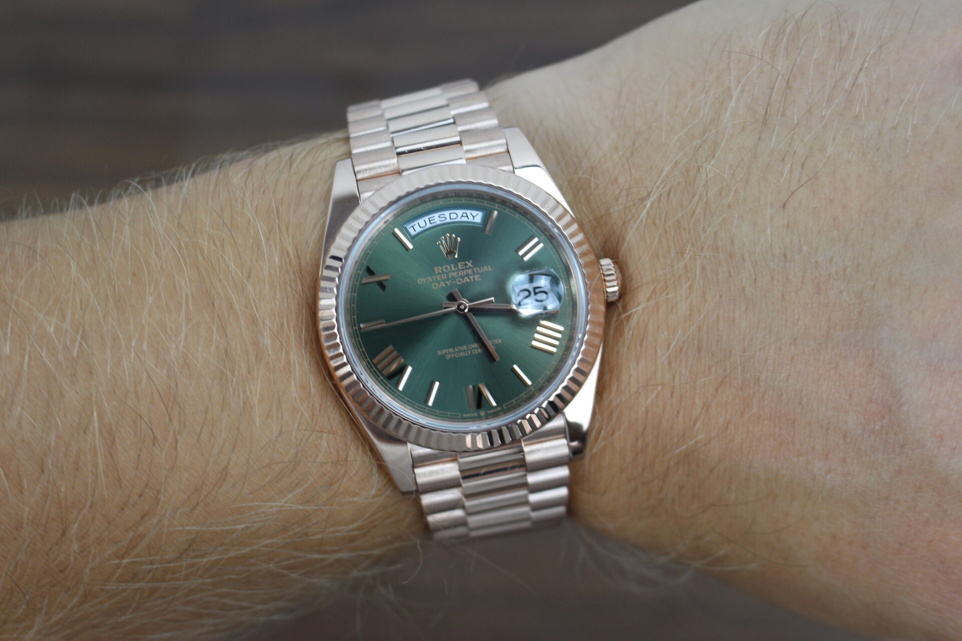 Rolex Day-Date 40 Rose Gold Olive 228235 on a wrist