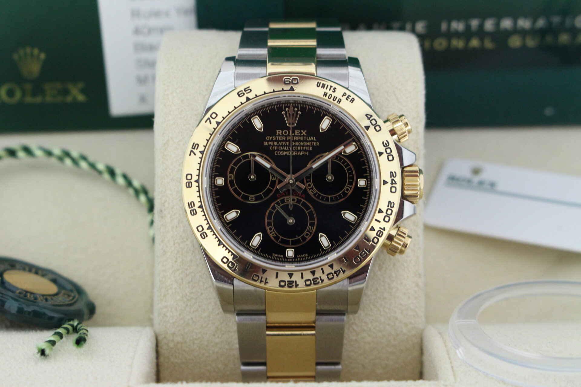 Close up of Rolex Daytona Black 116503 in it's box with both swing tags, booklets , original purchase receipt and warranty card