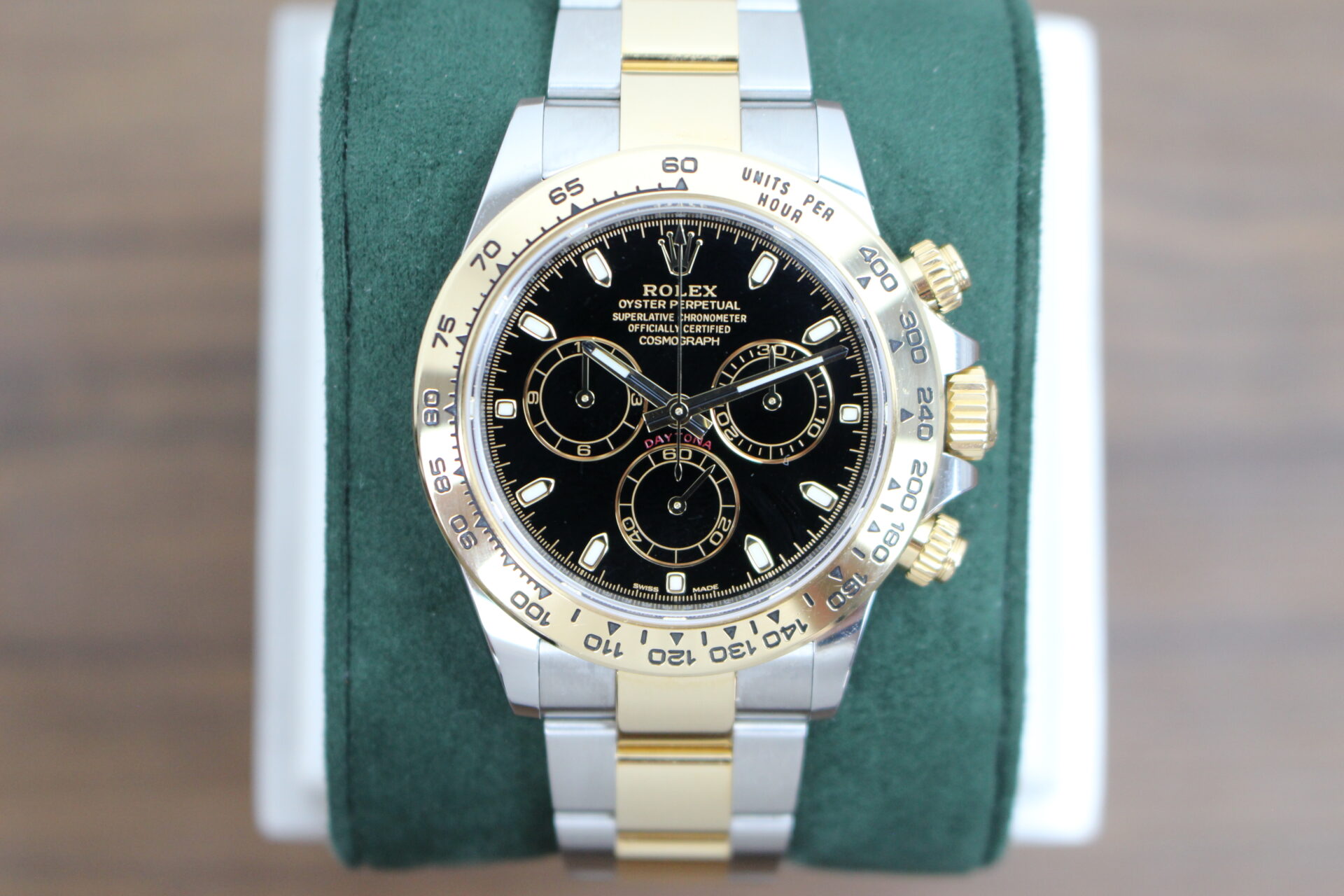 Rolex Daytona Black 116503 on a green cushion
