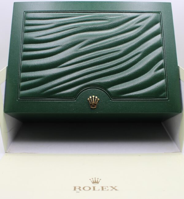 Rolex green wave box sat in the outer carboard box