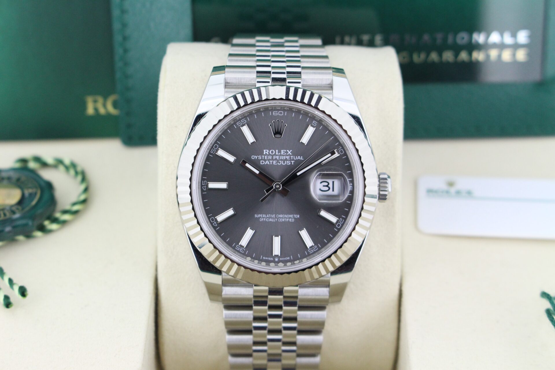 Close up of Rolex Datejust 41 Slate Grey 126334 in it's box with both swing tags, booklet and warranty card