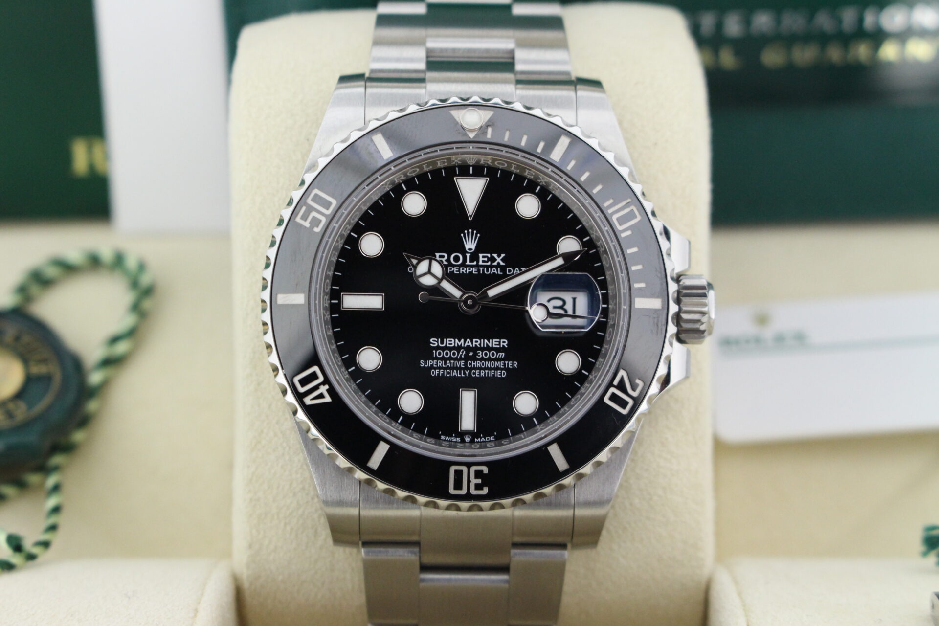 Close up of Rolex Submariner Date 41mm 126610LN in it's box with both swing tags, booklets and warranty card
